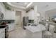 Bright kitchen featuring granite countertops, stainless steel appliances, and tiled backsplash at 9019 Flagstick Ln, Hudson, FL 34667