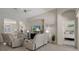 Spacious living room with leather furniture, tv, and open layout at 9019 Flagstick Ln, Hudson, FL 34667