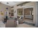 Covered patio with wicker furniture, flamingo decor and access to living room at 9019 Flagstick Ln, Hudson, FL 34667