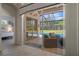 Covered patio featuring wicker furniture overlooking pool and back yard at 9019 Flagstick Ln, Hudson, FL 34667