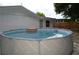Backyard above-ground pool provides fun and recreation during hot summer days at 9116 Gray Fox Ln, Port Richey, FL 34668