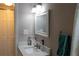 Bathroom featuring bright lighting, clean lines, and a granite counter at 9116 Gray Fox Ln, Port Richey, FL 34668