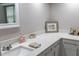 Close-up highlighting the elegant quartz countertop and stylish decor in the well-lit bathroom at 9116 Gray Fox Ln, Port Richey, FL 34668