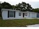 Lovely single-story home featuring fresh white paint and well-kept landscaping at 9116 Gray Fox Ln, Port Richey, FL 34668