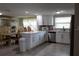 Updated kitchen with quartz countertops, stainless steel appliances, and white cabinetry at 9116 Gray Fox Ln, Port Richey, FL 34668