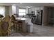 Modern kitchen with stainless steel appliances, white cabinets, and a breakfast bar at 9116 Gray Fox Ln, Port Richey, FL 34668