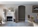 Charming living room with a decorative fireplace, neutral paint, and tile flooring at 9116 Gray Fox Ln, Port Richey, FL 34668