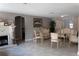 Elegant living room featuring classic furniture, a fireplace, and neutral tile flooring at 9116 Gray Fox Ln, Port Richey, FL 34668