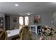 Open-concept living space with dining area and kitchen, perfect for entertaining at 9116 Gray Fox Ln, Port Richey, FL 34668