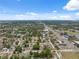 Aerial view of neighborhood, close to amenities and main roads with a mix of residential homes amid lush greenery at 9306 21St, Tampa, FL 33612