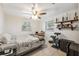 Cozy bedroom featuring neutral walls, two windows, and tile floors at 9306 21St, Tampa, FL 33612