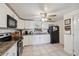 Updated kitchen featuring granite countertops, stainless steel appliances, and bright white cabinetry at 9306 21St, Tampa, FL 33612