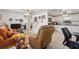 Open concept living space with tile floors, neutral walls, and easy access to the kitchen at 9306 21St, Tampa, FL 33612