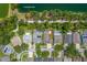 A neighborhood aerial view highlights the property's location close to a community path and a serene pond at 9729 Bay Colony Dr, Riverview, FL 33578