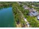 An aerial shot showing the property adjacent to a scenic pond and community path, offering privacy and nature access at 9729 Bay Colony Dr, Riverview, FL 33578