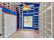 Bedroom with shelves, wood-look floors, and pool view at 9729 Bay Colony Dr, Riverview, FL 33578