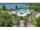 Aerial view of the community clubhouse with a large pool, offering residents recreational amenities and a gathering place at 9729 Bay Colony Dr, Riverview, FL 33578