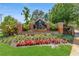 Stone entrance to the Lake St. Charles community featuring mature trees and shrubs at 9729 Bay Colony Dr, Riverview, FL 33578