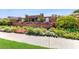 Community directory with colorful flower beds surrounded by manicured shrubs at 9729 Bay Colony Dr, Riverview, FL 33578