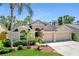 Charming single-Gathering home featuring a three-car garage and mature landscaping at 9729 Bay Colony Dr, Riverview, FL 33578
