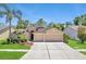 Charming single-Gathering home featuring a three-car garage and mature landscaping at 9729 Bay Colony Dr, Riverview, FL 33578