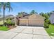 Charming single-Gathering home featuring a three-car garage and mature landscaping at 9729 Bay Colony Dr, Riverview, FL 33578