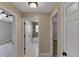 Hallway with tile floor leading to bathroom and bedrooms at 9729 Bay Colony Dr, Riverview, FL 33578