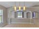 Open-concept living room with tile flooring, high ceilings, and neutral paint at 9729 Bay Colony Dr, Riverview, FL 33578