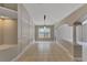 Spacious living room featuring tile flooring, and neutral wall color and trim at 9729 Bay Colony Dr, Riverview, FL 33578