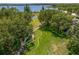 Picturesque park with walking paths, benches, mature trees and water views, ideal for relaxation at 9729 Bay Colony Dr, Riverview, FL 33578