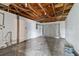 Unfinished basement offers potential with exposed ceiling and concrete flooring at 9744 Rainelle Ln, Port Richey, FL 34668