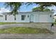 Inviting single-Gathering home with a driveway and manicured front yard, offering a pleasant first impression at 9744 Rainelle Ln, Port Richey, FL 34668