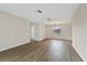 Open living area featuring wood flooring and lots of natural light at 9744 Rainelle Ln, Port Richey, FL 34668