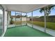 Spacious screened patio offers views of the backyard and neighboring houses at 9744 Rainelle Ln, Port Richey, FL 34668