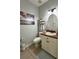 Cozy bathroom with tile floors, sink and vanity, and neutral wall color at 9808 Riverchase Dr, New Port Richey, FL 34655