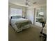 Cozy bedroom with a bed, closet, large mirror, and a window, ideal for relaxing and sleeping at 9808 Riverchase Dr, New Port Richey, FL 34655