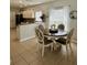 Cozy dining area with a round table, perfect for intimate meals and gatherings at 9808 Riverchase Dr, New Port Richey, FL 34655