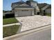 Inviting home with a spacious driveway and an attached two-car garage, perfect for Gathering living at 9808 Riverchase Dr, New Port Richey, FL 34655