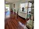 Bright living room with wood floors, neutral walls, and sliding glass doors at 9808 Riverchase Dr, New Port Richey, FL 34655