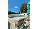 Relaxing backyard oasis with a private pool, lounge chairs, and lush landscaping at 9808 Riverchase Dr, New Port Richey, FL 34655