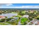 Aerial view of the community with the lake, golf course and clubhouse at 10181 Holly Berry Dr, Weeki Wachee, FL 34613