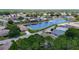 Beautiful aerial view of a lakeside residential neighborhood with lush green landscaping and well-maintained homes at 10181 Holly Berry Dr, Weeki Wachee, FL 34613