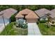 Overhead view of a well-kept residential property featuring manicured lawns and landscaping at 10181 Holly Berry Dr, Weeki Wachee, FL 34613