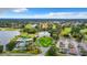 Aerial view of the community clubhouse showcasing the pool, tennis courts, and golf course at 10181 Holly Berry Dr, Weeki Wachee, FL 34613