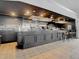 Stylish bar area with a well-stocked counter, featuring glass racks and seating for enjoying drinks and socializing at 10181 Holly Berry Dr, Weeki Wachee, FL 34613