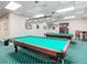Billiard room with pool tables, pendant lights, and cozy seating for entertainment at 10181 Holly Berry Dr, Weeki Wachee, FL 34613
