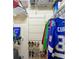 Well-organized closet featuring shelving, hanging rods, and shoe racks for storage at 10181 Holly Berry Dr, Weeki Wachee, FL 34613