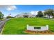 Exterior view of the community clubhouse and manicured lawn under a partly cloudy sky at 10181 Holly Berry Dr, Weeki Wachee, FL 34613