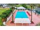 Beautiful community pool with seating and palm trees, offering a resort-style atmosphere at 10181 Holly Berry Dr, Weeki Wachee, FL 34613
