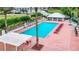 Inviting community pool area with lounge chairs and a spa, perfect for relaxation at 10181 Holly Berry Dr, Weeki Wachee, FL 34613